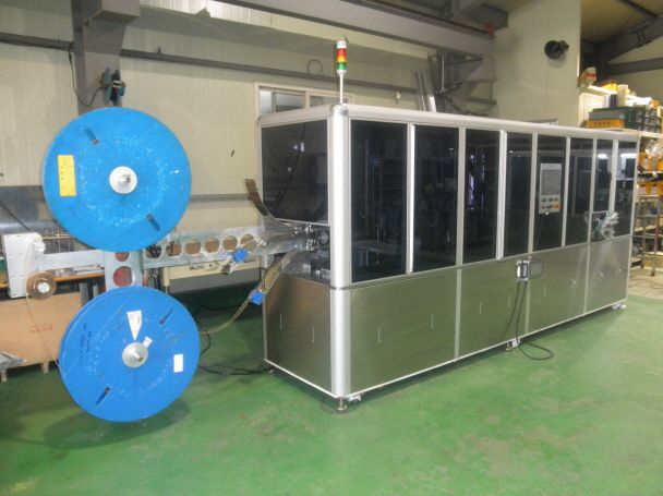 테이프 자동 부착기